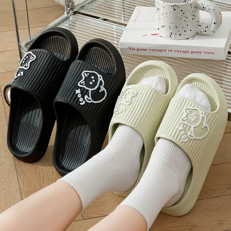 Women's green cat slippers with thick platform sole and flip-flop design.