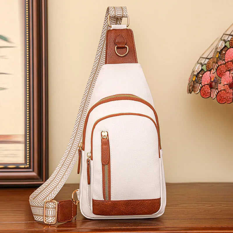 Soft brown PU women's crossbody chest bag with open front pocket and adjustable strap.