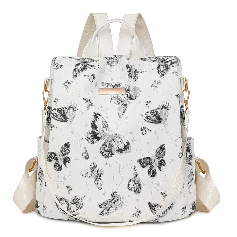 Butterfly print PU backpack on a physiological curve backplate, shown in khaki colour.