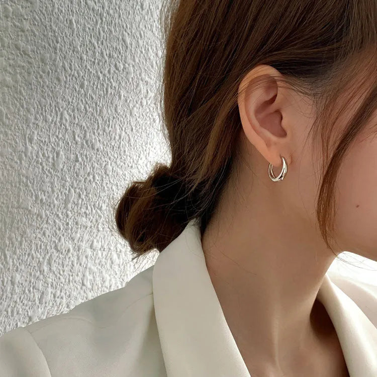Women's minimalist copper water drop earrings in gold and silver, shown in small, medium, and large sizes.