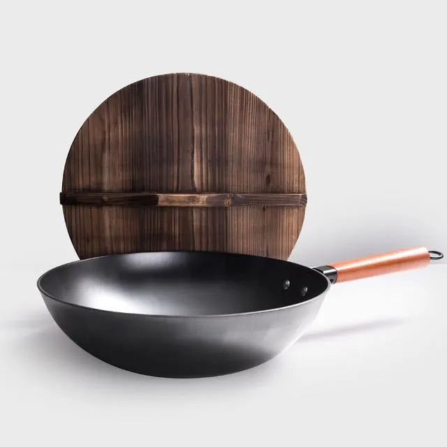 Traditional black iron wok with wooden handle measuring 32cm
