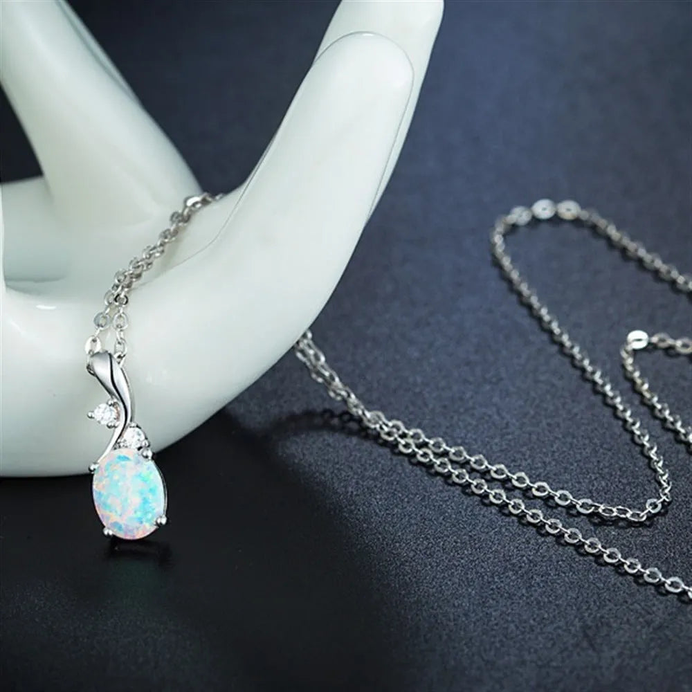 Water drop shaped opal pendant necklace with adjustable chain in rose gold or white finish