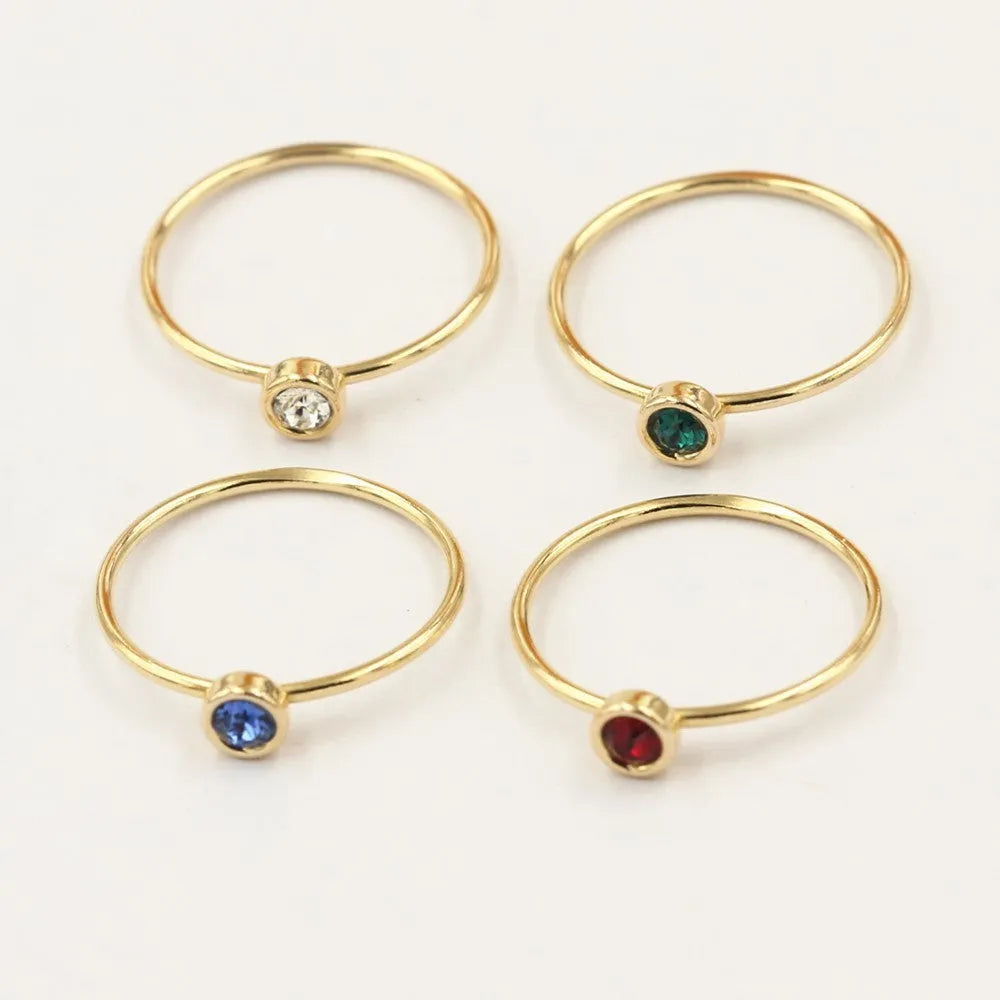 14K gold gilded brass knuckle ring with zircon stones in green blue dark red white colours