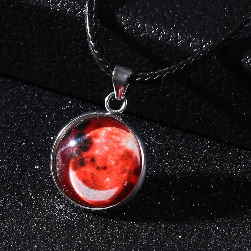 Luminous moon and constellation night sky pendant on an extendable alloy necklace chain.