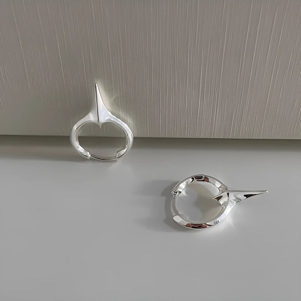 Women's geometric star ear clip earrings with electroplated white gold finish on copper