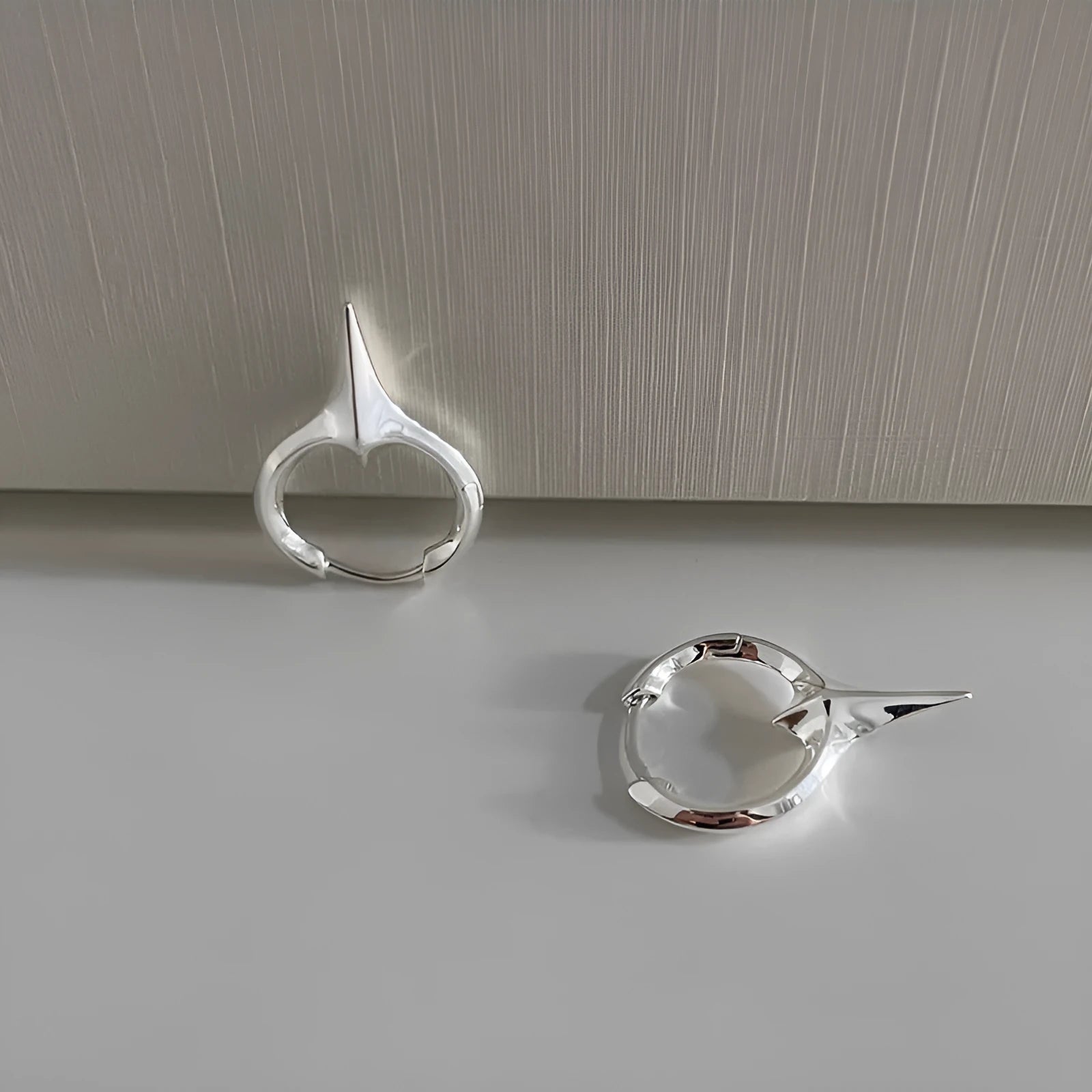 Women's geometric star ear clip earrings with electroplated white gold finish on copper