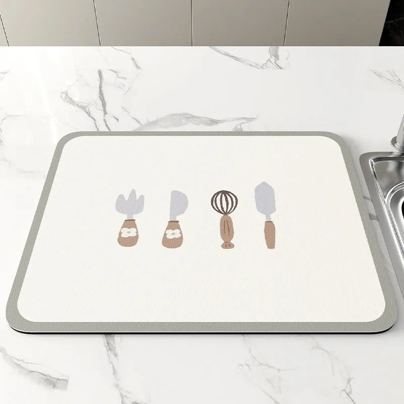 Square diatomite kitchen draining mat in camellia purple on a kitchen worktop, with a teacup resting on it