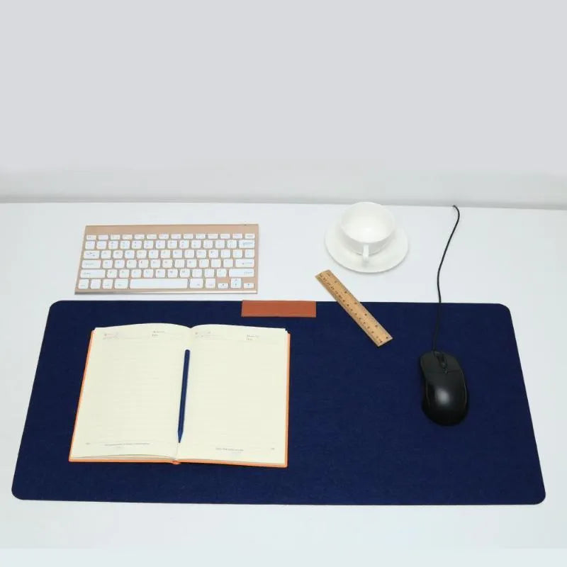 Felt gaming keyboard pad in 30x60cm size, single-sided, black colour, on desk with keyboard and mouse