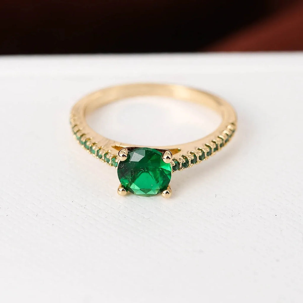 Geometric hexagon zircon ring on copper band in a gold and rose red electroplated finish.