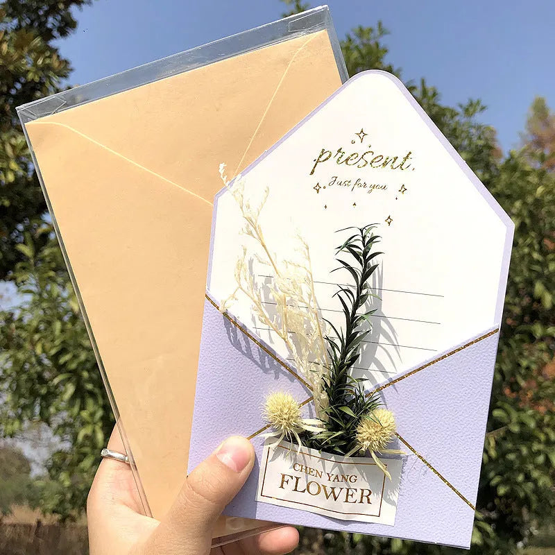 Handmade 3D boxed greeting card with butterfly shape, hot stamping, and artificial flowers on coated paper.