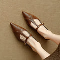 Brown women's low-cut flat shoes with rounded toe and a mid heel, made of cowhide leather.