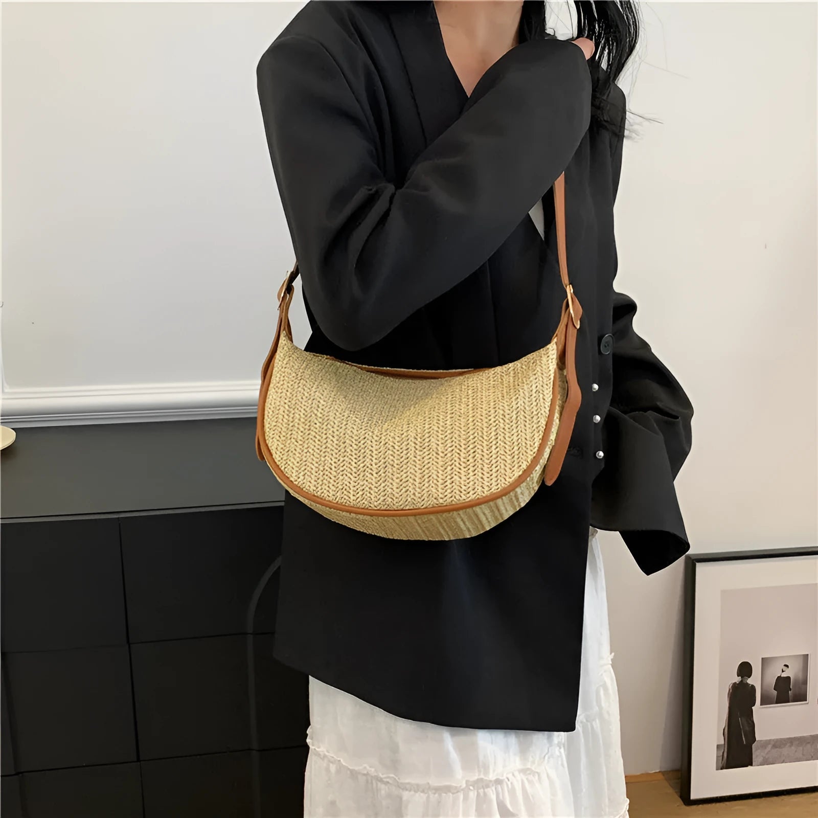 Women's knitted straw woven crossbody bag showing internal phone and file compartments