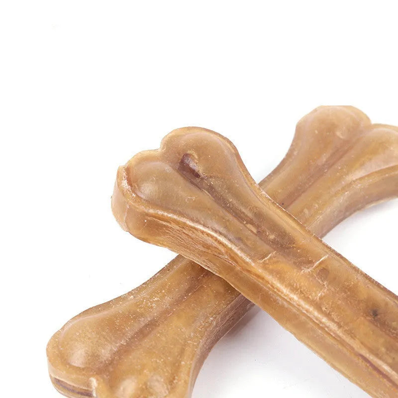 Buffalo leather dog chew stick laid flat, showing natural hide texture and bone-like shape