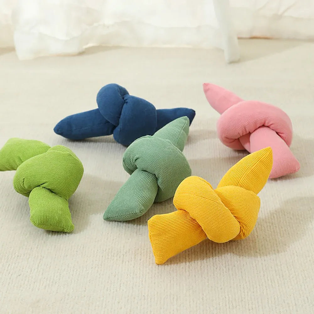 White cotton dog rope toy with multiple knots for tug play and chewing