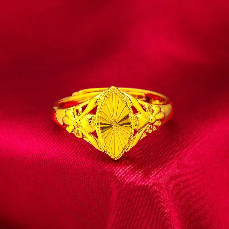 Gold-coloured brass flower ring with geometric texture and open diamond shape design