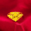 Gold-coloured brass flower ring with geometric texture and open diamond shape design