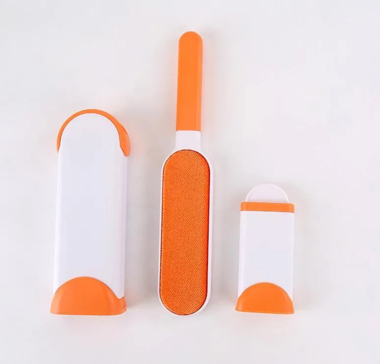 Blue reusable pet hair removal comb with double-sided brush next to its self-cleaning base.