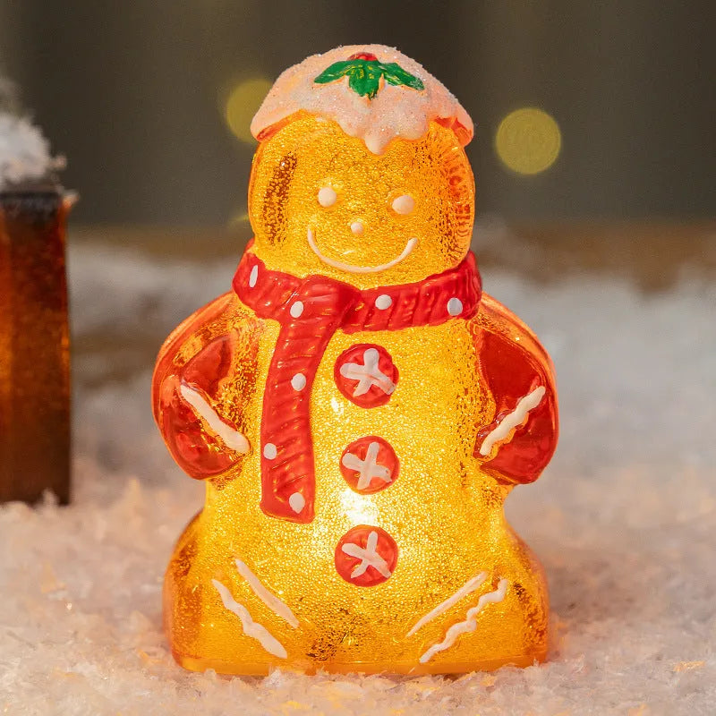 Glowing gingerbread man Christmas ornament with snowman design and LED lights