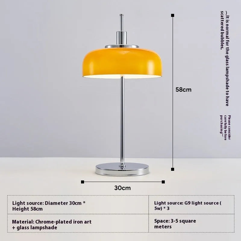 Retro table lamp with glass lampshade and chrome finish on a wooden surface
