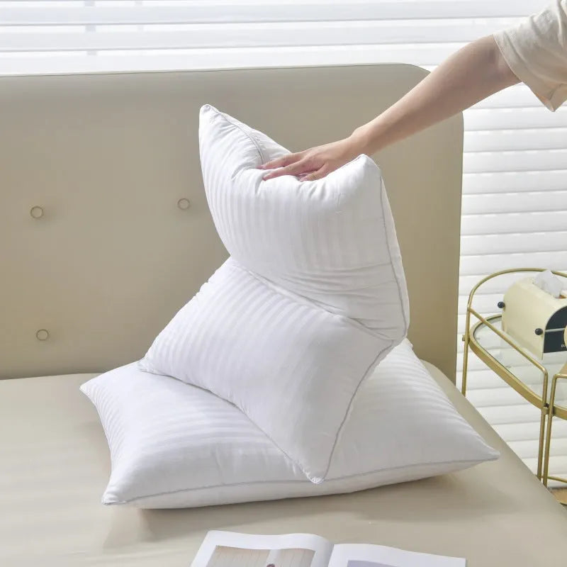 White cotton satin stripe pillow with feather filling in three size options for hotel or home use