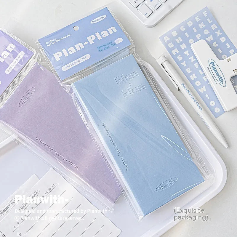 Embossed simple visual daily meter notebook in blue, showing its cover and page layout.