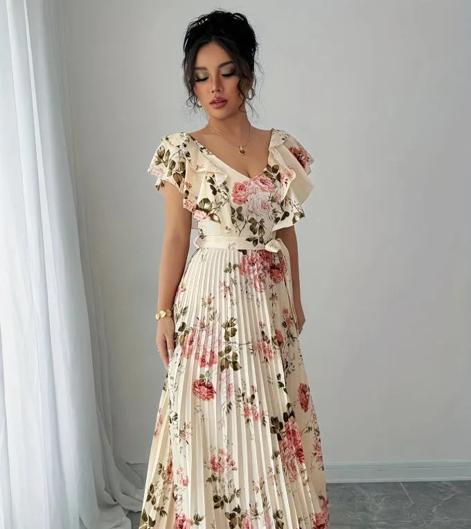 Apricot floral print dress with V-neck, ruffled sleeves, and a swing skirt.