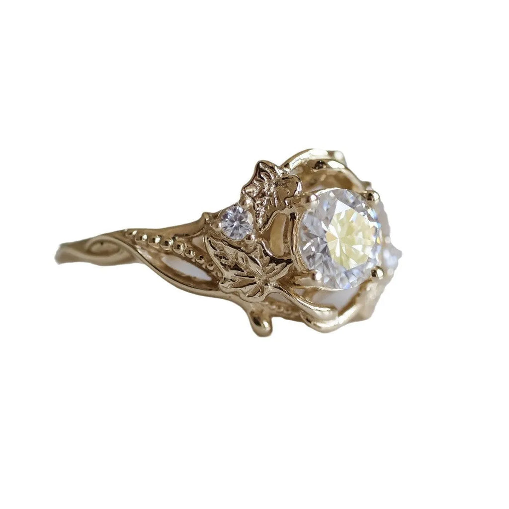Gold alloy ring with brushed finish on neutral background