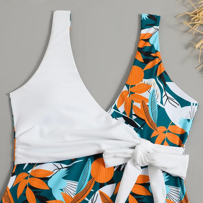 Women's high waist one-piece swimsuit in printed black or white pattern with conservative styling