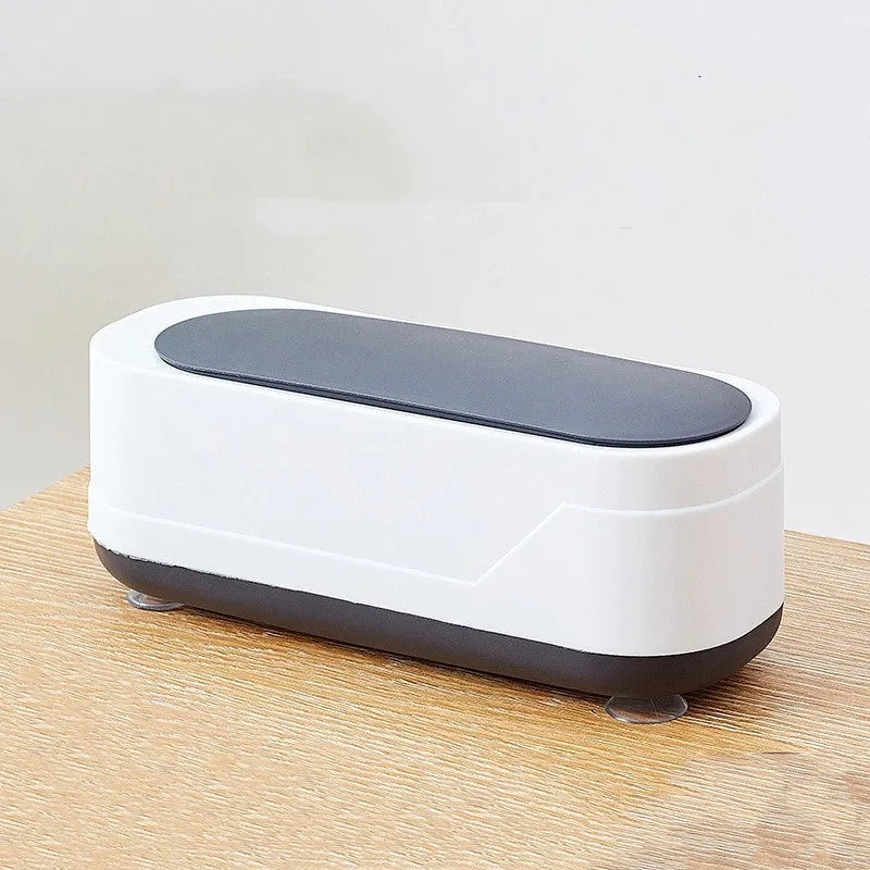 Black and white multifunctional ultrasonic cleaner for eyeglasses and jewellery with high frequency vibration