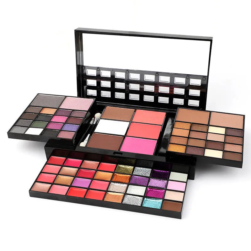 74 colour makeup palette set open showing four layers of eyeshadows, lip glosses, blushes, and contour powders with brushes