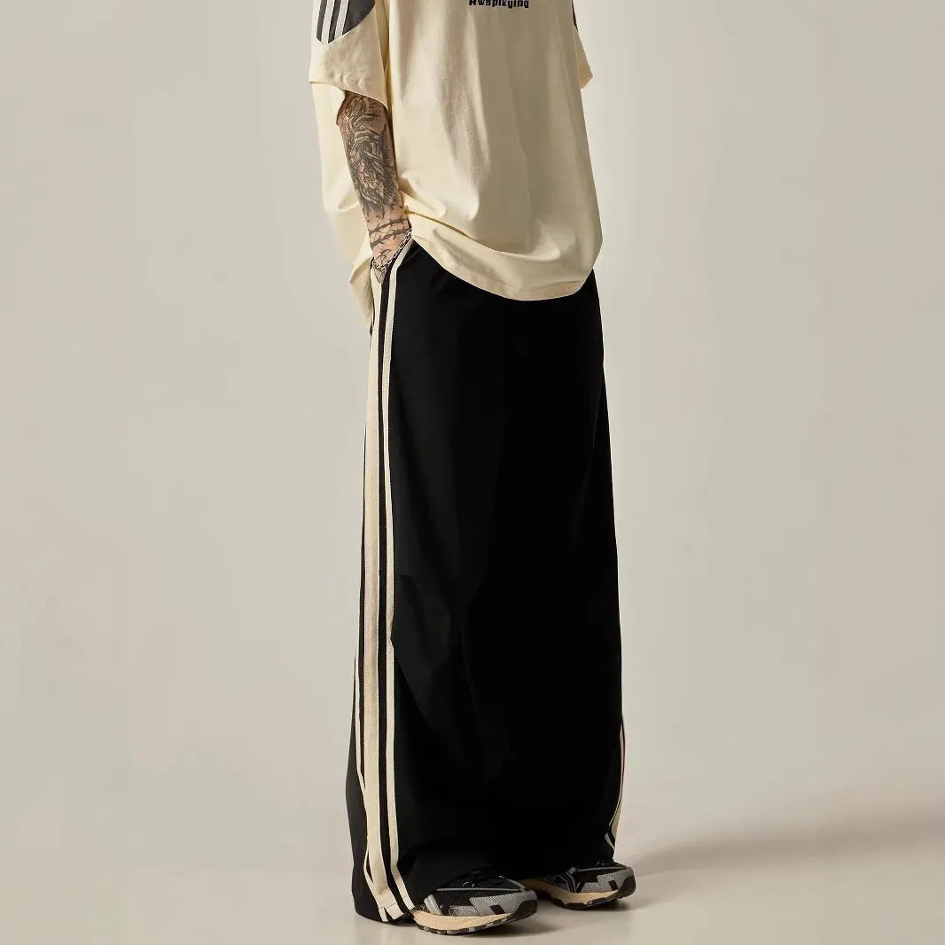 Black men's wide leg climbing trousers with high waist and straight leg design.
