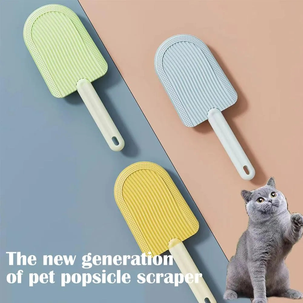 Soft silicone foldable pet hair brush in green, blue and yellow, used for grooming cats and dogs