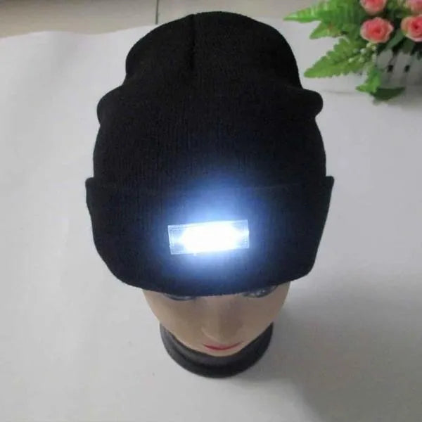 LED headlamp glowing knit warm hat in beige with built-in flashlight for camping