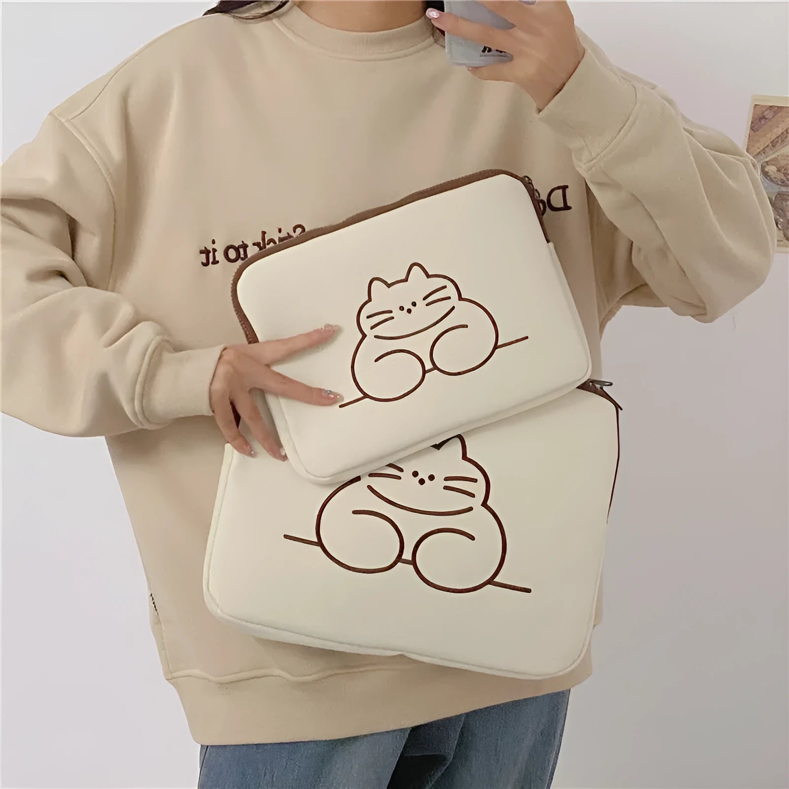 Embroidered animal nylon tablet protective sleeve with zipper closure showing fat cat design