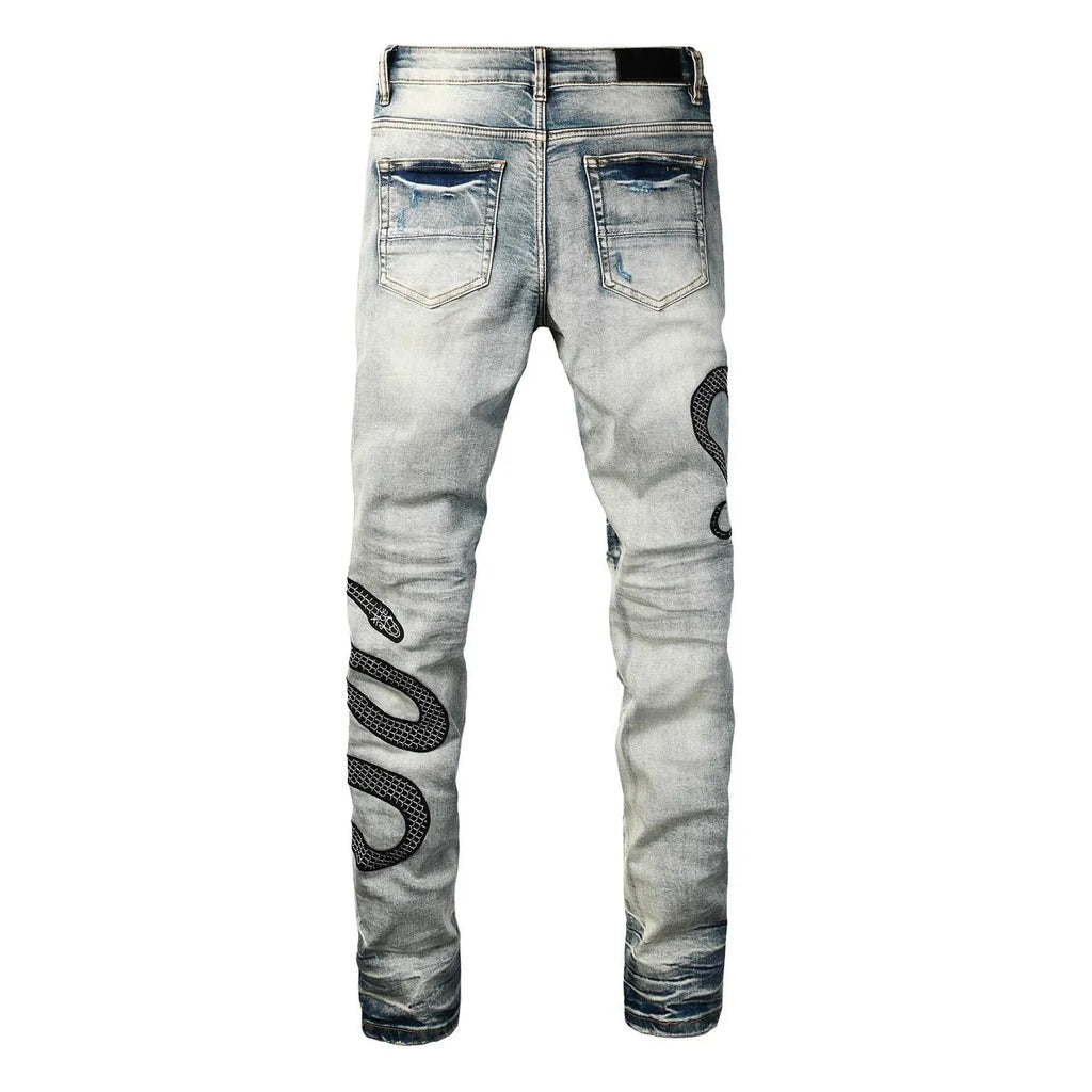 Men's distressed blue skinny jeans with a retro wash, shown with a button fly and a tight leg fit.