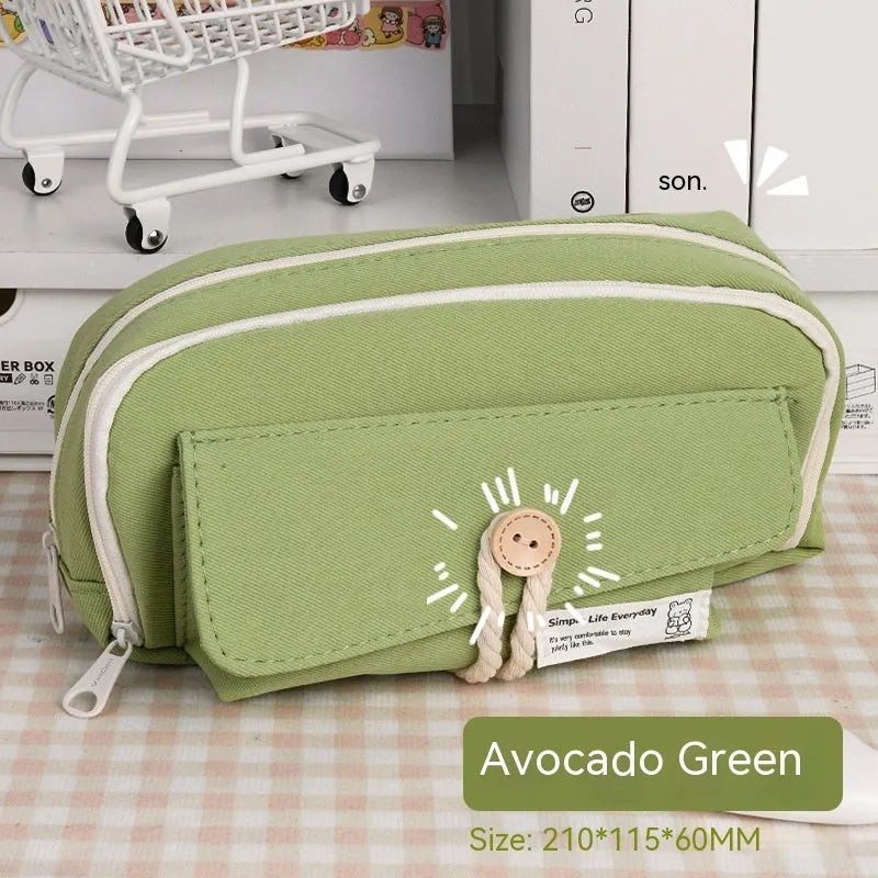 Green Korean-style canvas pencil case open, showing large capacity for pens and stationery.