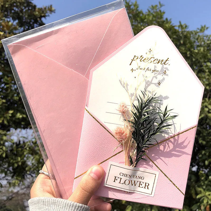 Handmade 3D boxed greeting card with butterfly shape, hot stamping, and artificial flowers on coated paper.