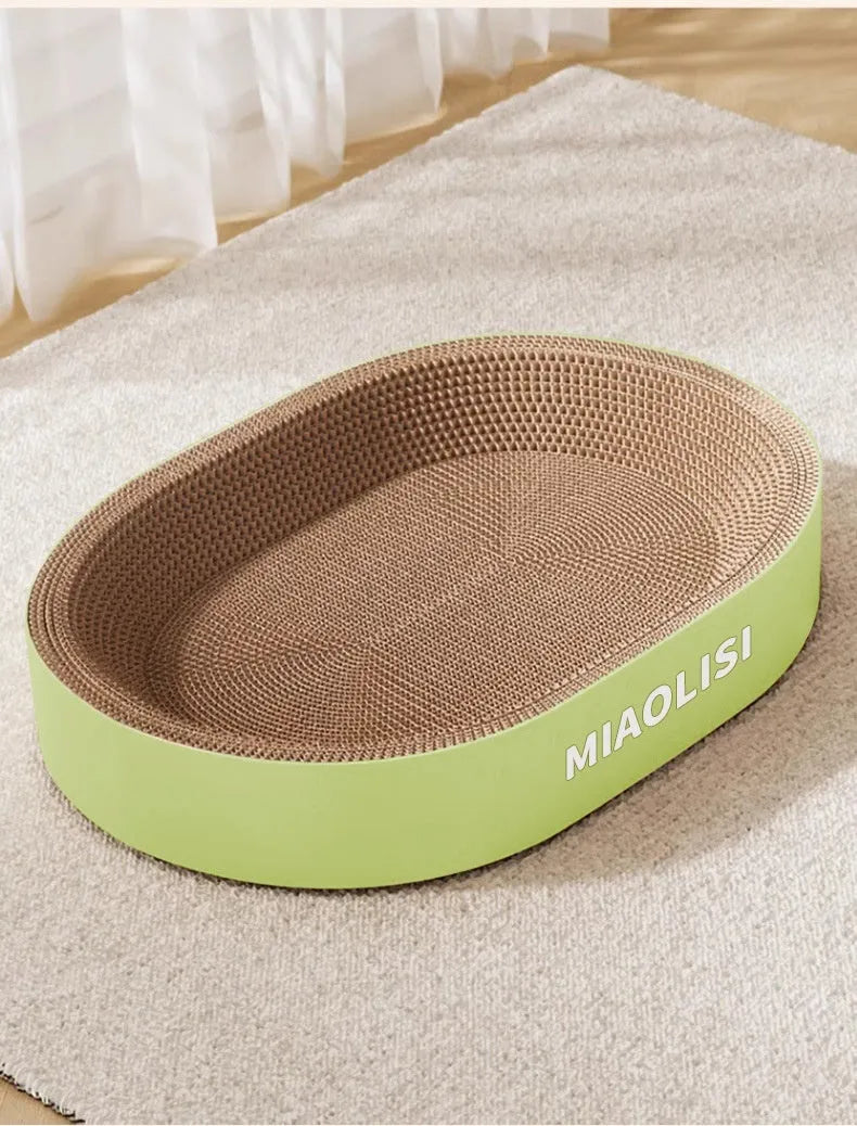 Green oval corrugated paper cat scratch board and nest measuring 55cm diameter
