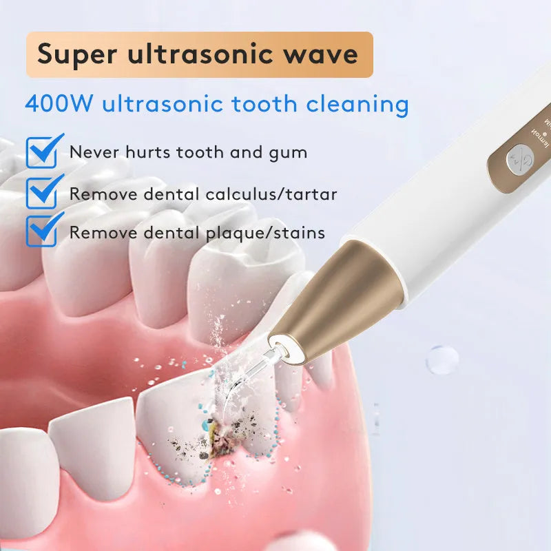 Gold coloured ultrasonic tooth cleaning device for removing tartar and stains.
