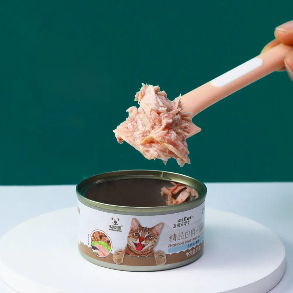 Green, pink, and purple long-handle TPR spoons for scooping canned wet food for cats and dogs.