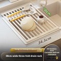 Foldable milky white stainless steel kitchen draining rack shown open and closed, with size options from 32cm to 55cm wide.