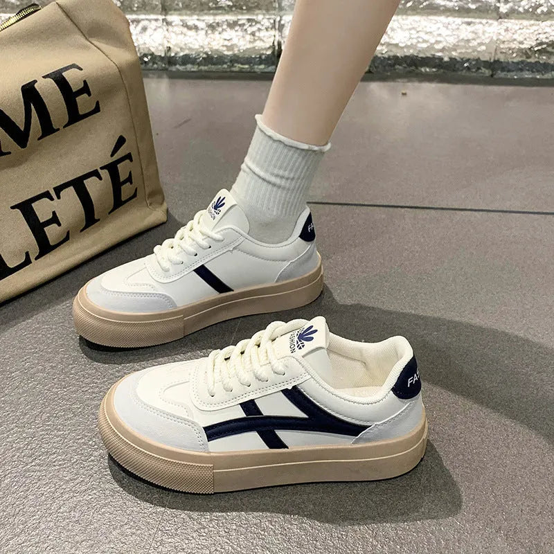 Brown and blue low-top women's casual lace-up shoes with round toe and patent leather finish.