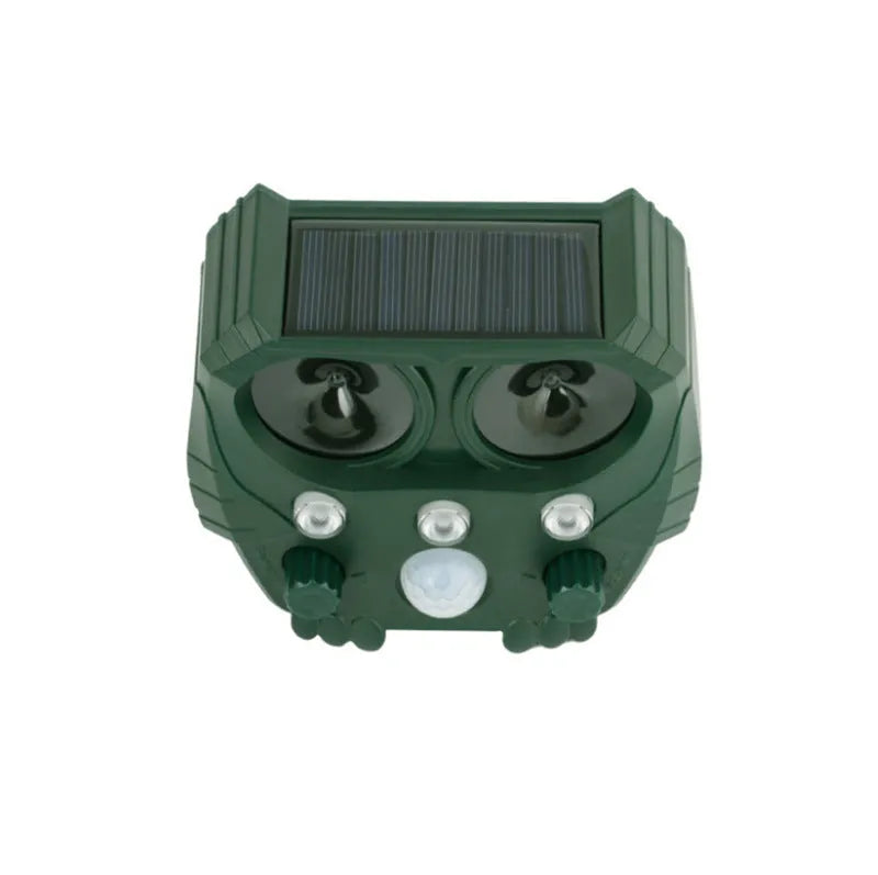 Green solar-powered ultrasonic dog and pest repeller unit for outdoor garden use.