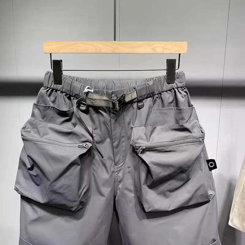 Men's large size work shorts in black or grey with loose pockets and straight leg hem