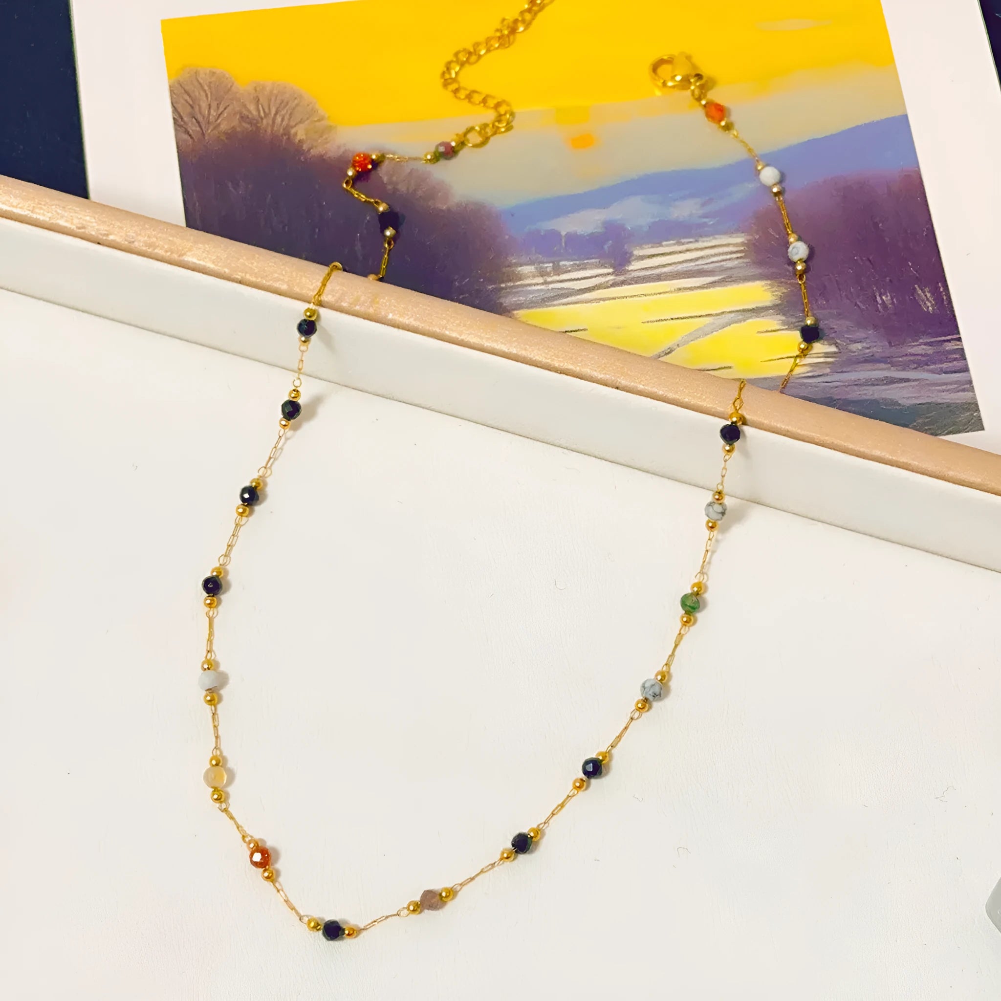 Gold titanium steel necklace with a natural stone pendant on an adjustable O-ring chain.
