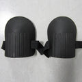 A pair of EVA foam knee pads in army green colour, showing dimensions of 19cm by 15cm.