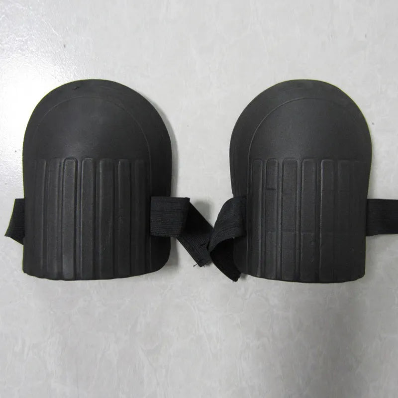 A pair of EVA foam knee pads in army green colour, showing dimensions of 19cm by 15cm.
