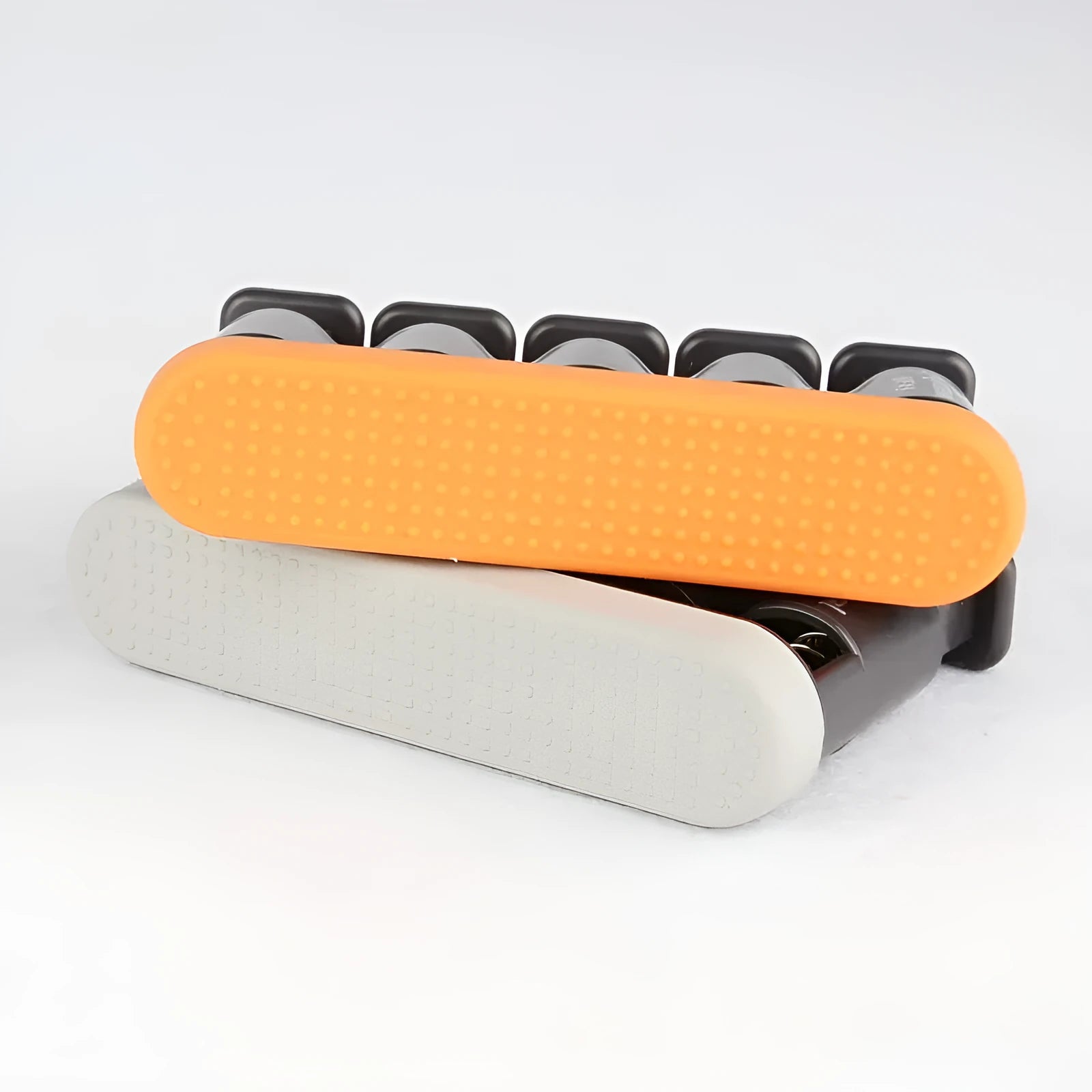 Grey or orange silicone finger trainer for musical instrument practice and climbing