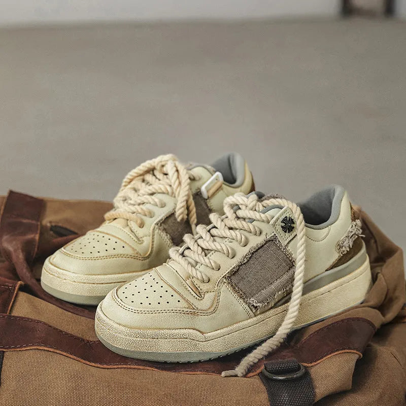 Beige vintage patch skateboard shoes with low-top design and round toe