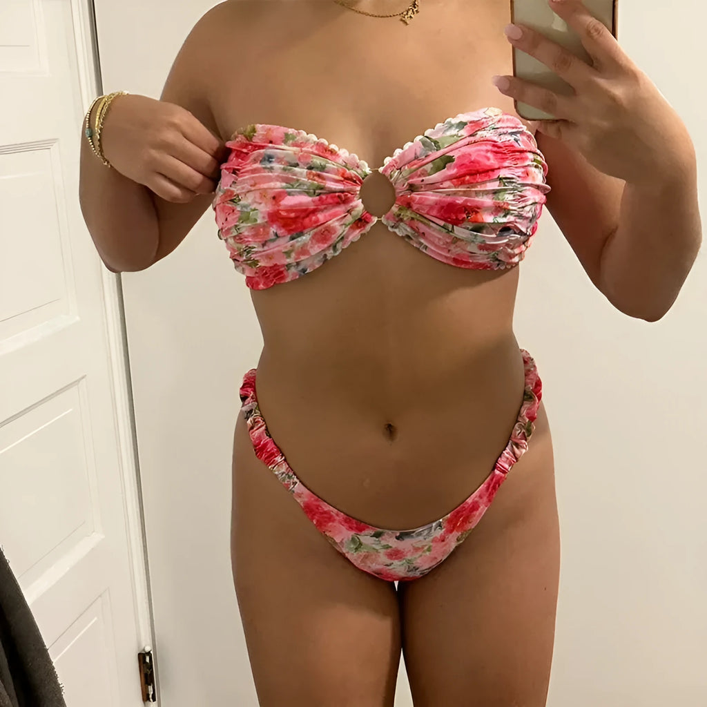A colourful floral print lace tube top bikini set with matching shorts on a mannequin.